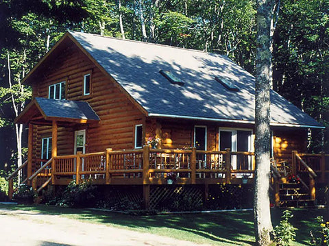 Premium Exterior Clear Top Coat For Stained Logs And Timber Siding Heavy Duty Semi Gloss Formula applied on a log cabin.