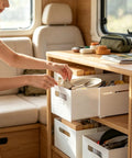 Woman organizing kitchen utensils in white drawers using Slick Adjustable Drawer Organizer Slides Easy To Block Any Gap No Sweat Guaranteed For Organizing Makeup Pens And Gear In Kitchen Drawers Or Office Setups.