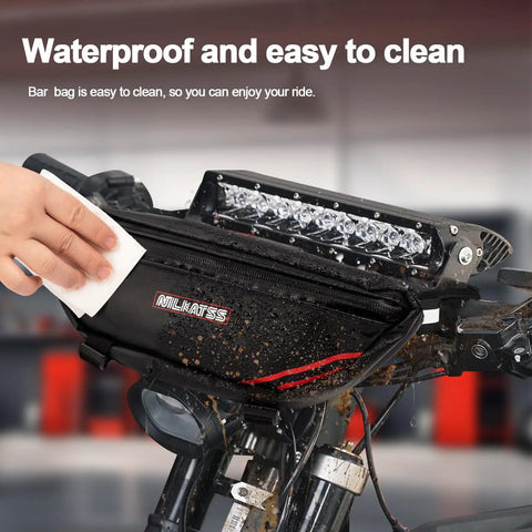 Waterproof Handlebar Tool Bag Made With PVC Tarpaulin For Dirt Bikes That Fits Sur Ron Segway Talaria Off Road Rides And Keeps Your Essentials Dry In Wet Weather Ready For Any Trail Or Wet Conditions, wiped clean on dirt bike handlebars