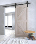Sliding barn door installed with Six Point Six Foot Sliding Barn Door Hardware Kit With Five Track System For Doors From Thirty Five To Forty Inches Wide Built Tough With Nylon Bearings And J Shape Hangers For Smooth Quiet Operation.