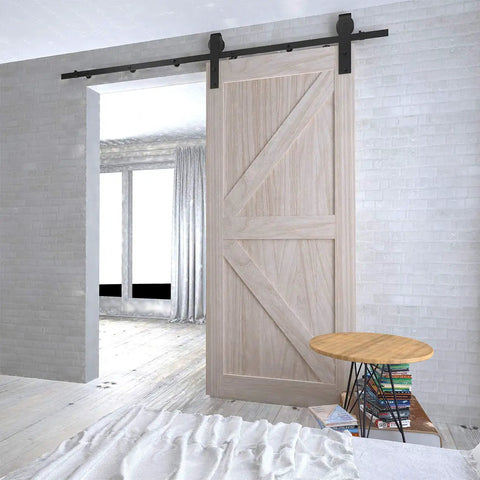 Sliding barn door installed with Six Point Six Foot Sliding Barn Door Hardware Kit With Five Track System For Doors From Thirty Five To Forty Inches Wide Built Tough With Nylon Bearings And J Shape Hangers For Smooth Quiet Operation.