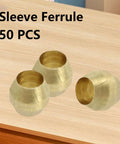 Three brass 1/8 in compression ferrules on a wood table