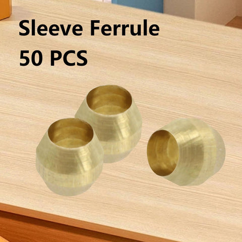Three brass 1/8 in compression ferrules on a wood table