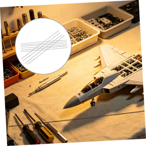 10 Piece Carbon Fiber Rod Set For Model Aircraft And Kites Lightweight And Easy To Install Round Rods For RC Aircraft Upgrades And Wing Spars Perfect For Replacing Worn Or Damaged Parts And Strengthening Structures on a workbench with tools and model jet