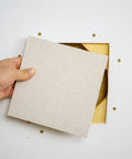 Inserting panel from Pro Grade Drywall Repair Kit For Home And Office Fix Holes Fast With 12x12 Inch Panels Includes Backing Boards Joint Compound Patch Sanding Pad And All Essential Tools For A Clean Seamless Finish into wall hole