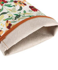 Close-up of the interior polyester cuff of thorn-proof leather rose gardening gloves with faux suede palm for women