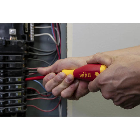 Using Insulated SoftFinish Cushion Grip Screwdriver Tray Set on electrical panel, focus on safe for live circuits handle.