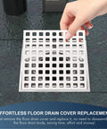 Hand replacing Built Tough Brushed Nickel Square Shower Drain Cover 3-7/8 Inches Wide Rust Resistant Stainless Steel.