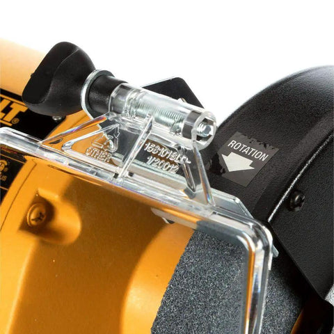Close-up of 8 Inch Bench Grinder With Three Quarter HP Induction Motor, 3600 RPM, Rugged Cast Iron Base, showing rotation indicator.