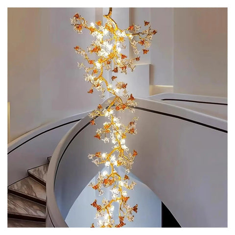 Premium Branch Style Crystal Chandelier With Antique Brass Finish illuminated, hanging in a modern staircase, elegant pendant lamp design.