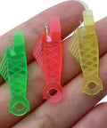 Three fish-type needle threaders on a hand showcasing the Five Piece Fish Type Needle Threaders for Sewing Machines and Hand Sewing.