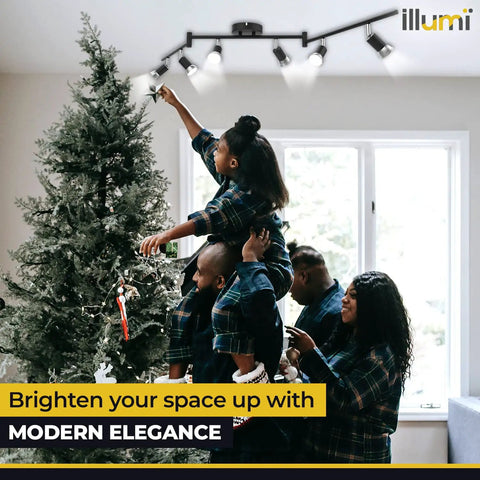 Family decorating Christmas tree under Flexible Ceiling Track Lighting Kit With Six Spot Lights And Seven LED GU10 Bulbs Included.