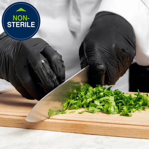 Person chopping herbs wearing Built Tough Black Nitrile Exam Gloves 5.1 Mil Heavy Duty Powder Free Disposable.
