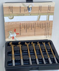 Top Shelf 7 Piece Multi Curve Angle Forstner Drill Bit Set With Heavy Duty Titanium Coating in storage case with usage guide.