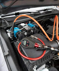 CKMTA12 12V On Board Twin High Flow Air Compressor installed in vehicle engine bay for air lockers and tire inflation