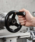 Person using Two Pack Lathe Crank Handle Handwheel Set 4 Inch Rotating Machine Tool Handwheel With Anti Slip Bakelite Grip And Iron Construction