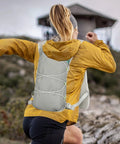 Person hiking with 2L Hydration Backpack With Ultra Lightweight Breathable Mesh Reflective Vest And Ergonomic Adjustable Straps