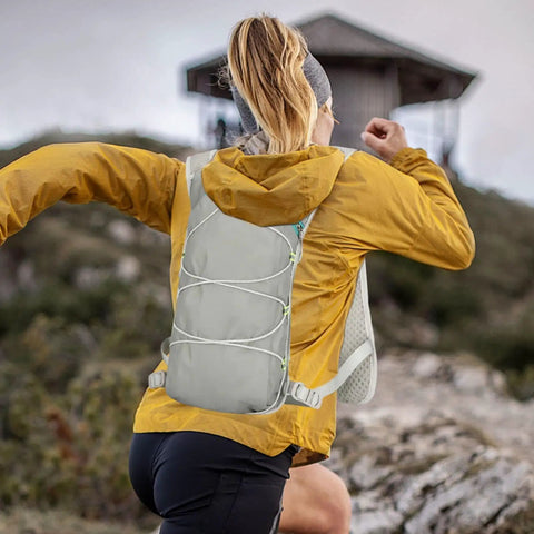 Person hiking with 2L Hydration Backpack With Ultra Lightweight Breathable Mesh Reflective Vest And Ergonomic Adjustable Straps
