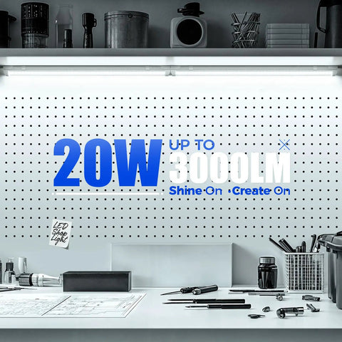 2Ft LED Shop Light 20W 3000LM 6500K T8 Fixture With Clear Cover in a workshop setting with tools and pegboard