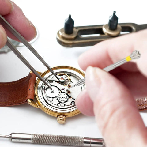Repairing watch mechanism using 8 Piece Pro Grade Precision Jewelers Screwdriver Set For Watch Eyeglasses Jewelry And Electronics Repair