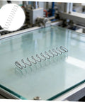 Two Pack Industrial Trapezoidal Flat Compression Springs 1x9.5x35x160mm on machinery glass surface