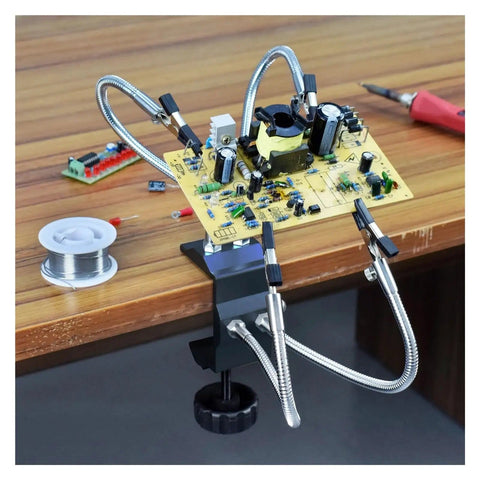 Four Arm Third Hand Soldering Station With Flexible Gooseneck Arms And Removable Tip Clamps holding PCB on workbench
