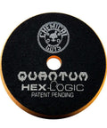 Close-up of Hex-Logic Quantum Buffing Pad with Chemical Guys logo, showcasing pad texture and lettering on black surface.