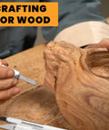 Person using Exacto Knife Set For Precision Crafting, 16 Piece Hobby Knife Kit With Razor Sharp Blades on wooden sculpture.