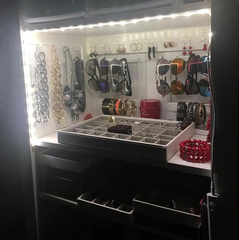 Jewelry closet illuminated by 9.8ft Under Cabinet LED Strip Lights With Motion Sensor And Battery Power Auto Or Manual Modes Ideal For Closet Kitchen Bedroom Stairs Basement Trunk And More White 4000K