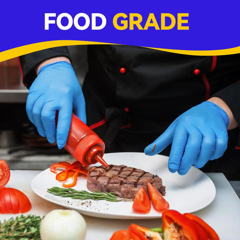 Chef wearing Latex Free Vinyl Exam Gloves 4 Mil Disposable Small Blue Box Of 100 Powder Free For Medical Dental Lab Use with Tough As Nails Feel and Superior Tactile Feedback, garnishing steak with sauce in kitchen.