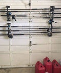 Garage Door Organizer Rack for Fishing Gear and Tools 18 Inch ABS Plastic Rod Holder mounted on garage door.
