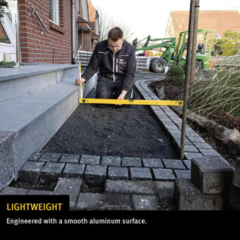 48 Inch Heavy Duty Aluminum Spirit Level Featuring Dead On Accuracy being used for smooth layout work in construction.