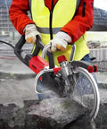 Boss-Grade 9500W Electric Concrete Ring Saw with 270mm Cutting Power in use, cutting stone with water spray.