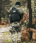 Person hiking with Tactical Sling Bag For Men Detachable Water Bottle Holder MOLLE Backpack With Hidden Pocket EDC Day Pack