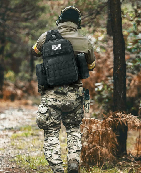 Person hiking with Tactical Sling Bag For Men Detachable Water Bottle Holder MOLLE Backpack With Hidden Pocket EDC Day Pack