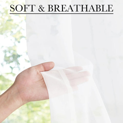 Hand holding Two Panel Sheer Voile French Door Curtains With Light Filtering, showcasing softness and breathability.