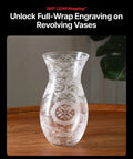 Glass vase with white frosted floral etching on a wooden table