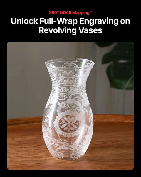 Glass vase with white frosted floral etching on a wooden table