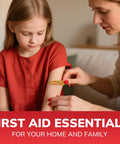 Adhesive bandage on a child's forearm being applied by an adult.