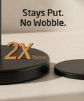Zero Fuss Freestanding Toilet Paper Holder Stand In Classic Black with heavy duty base, emphasizing stability and thickness.