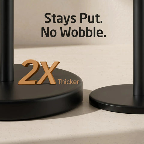 Zero Fuss Freestanding Toilet Paper Holder Stand In Classic Black with heavy duty base, emphasizing stability and thickness.
