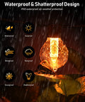 Close-up of a 50ft LED Patio String Lights With Dimmer And App Control bulb in rain, showcasing waterproof feature.