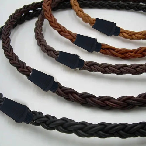 Four braided cables with black strain reliefs, featuring 50 Pairs Plastic Pendant Lighting Strain Reliefs for Lamps and Fixtures M10 Cable Glands Cord Grips for Wiring Ceiling Light Replacement Heavy Duty Black.