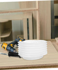 Transparent Drill Dust Collector Cover For Electric Drills And Grinders With Rock Solid Debris Shield sits on a worktable with tools.