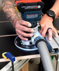 Knockout Router Base Plate Dead Nuts Fits Bosch Colt 18V Power Tool With 6 Inch Round Clear Acrylic pre drilled holes in use.