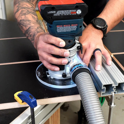 Knockout Router Base Plate Dead Nuts Fits Bosch Colt 18V Power Tool With 6 Inch Round Clear Acrylic pre drilled holes in use.