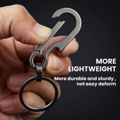 Hand holding the Multifunction Titanium Carabiner Keychain Go To Everyday Carry Ultra Lightweight Outdoor Key Holder Minimalist Key Ring.