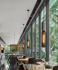 5 Light Concrete Pendant Light With Metal Mesh Shade For Kitchen Island And Dining Room hanging in dining area