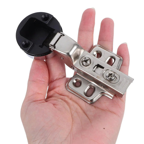 Hand holding a four piece stainless steel soft close cabinet door hinge for glass doors with hydraulic damping, self closing.