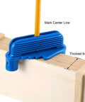 Blue plastic center finder tool on wood, pencil inserted to mark center line; front view, fits standard pencils